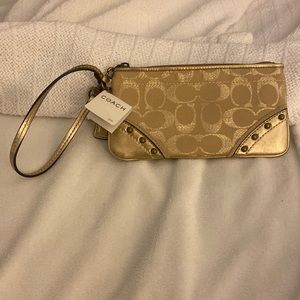 Gold / brass Coach Wristlet, 7 1/2 x 4 inches. NWT.